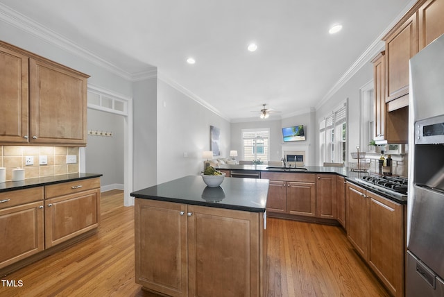 106 Painted Turtle Ln, Cary, NC 27519 - kitchen with a ceiling fan, dark countertops, a sink, light wood-style floors, and recessed lighting
