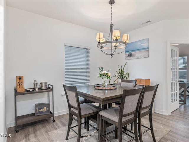 146 Bent Willow Dr, Clayton, NC 27527 - dining area featuring a chandelier, light wood finished floors, and baseboards