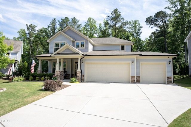 212 Hardwick St, Clayton, NC 27527 - craftsman inspired home featuring stone siding, a garage, driveway, a porch, and a front yard
