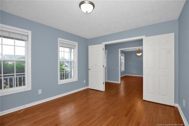 188 Fallingleaf Dr, Raeford, NC 28376 - unfurnished room with baseboards and wood finished floors