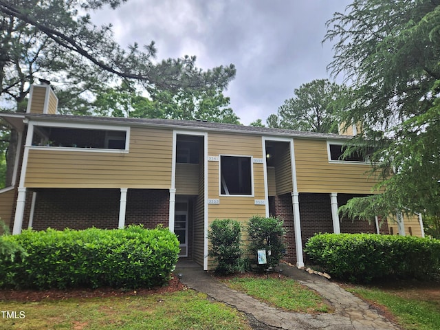 3559 Mill Run, Raleigh, NC 27612 - view of front of house featuring brick siding and a chimney