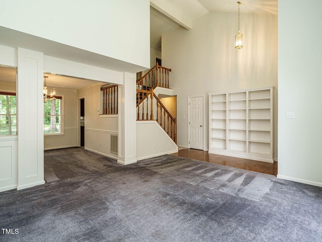 108 S Drawbridge Ln, Cary, NC 27513 - unfurnished living room featuring a chandelier, carpet floors, high vaulted ceiling, and stairs