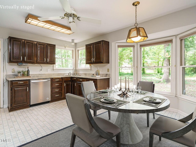 108 S Drawbridge Ln, Cary, NC 27513 - kitchen featuring stainless steel dishwasher, dark brown cabinets, light countertops, and healthy amount of natural light