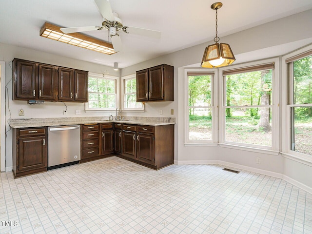 108 S Drawbridge Ln, Cary, NC 27513 - kitchen featuring stainless steel dishwasher, ceiling fan, dark brown cabinets, and healthy amount of natural light