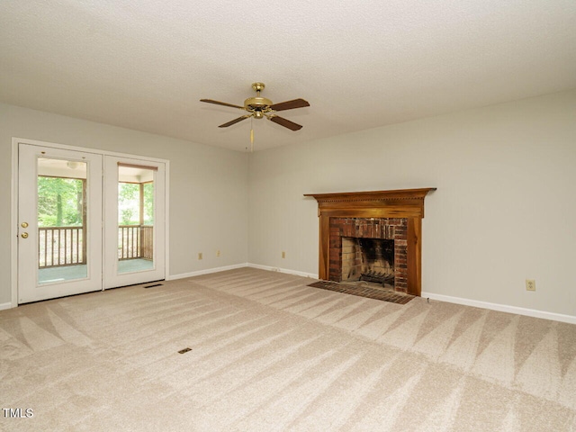 108 S Drawbridge Ln, Cary, NC 27513 - unfurnished living room featuring a ceiling fan, carpet, and a fireplace
