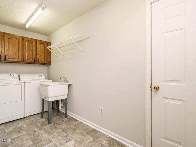 108 S Drawbridge Ln, Cary, NC 27513 - washroom featuring washing machine and clothes dryer, cabinet space, and a textured ceiling