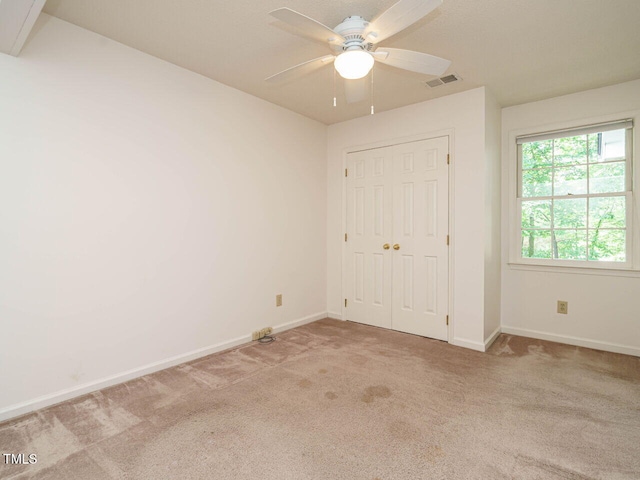 108 S Drawbridge Ln, Cary, NC 27513 - unfurnished bedroom featuring carpet floors, a closet, and ceiling fan