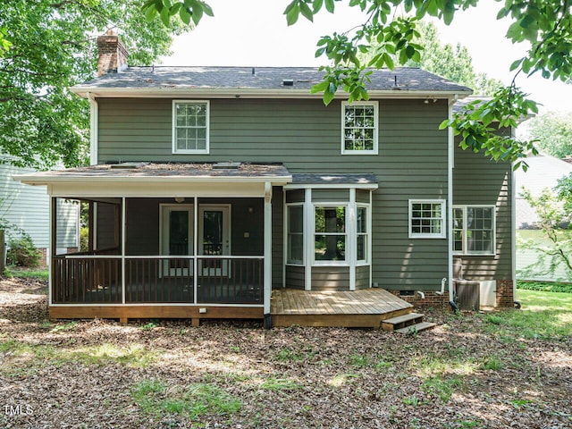 108 S Drawbridge Ln, Cary, NC 27513 - back of property with a chimney, a sunroom, and roof with shingles