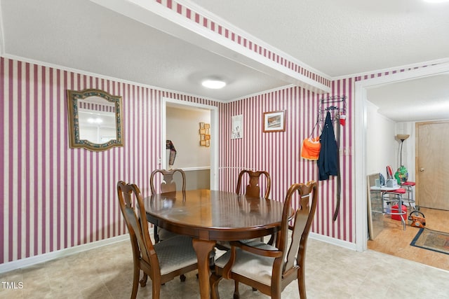 480 Five Bridge Rd, Clinton, NC 28328 - dining room featuring a textured ceiling, crown molding, wallpapered walls, tile patterned floors, and baseboards