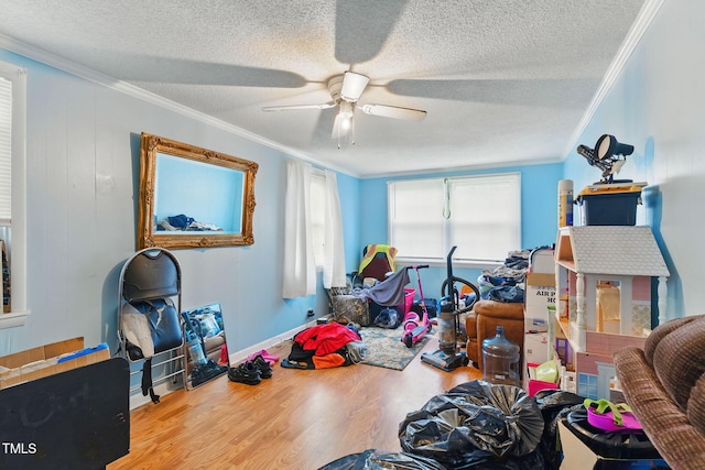 480 Five Bridge Rd, Clinton, NC 28328 - game room featuring crown molding, wood finished floors, a textured ceiling, ceiling fan, and baseboards