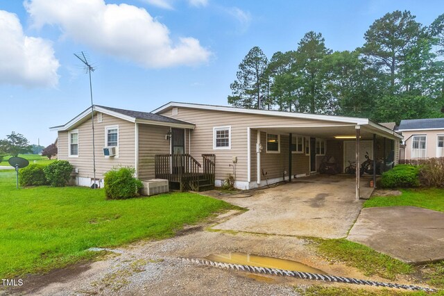 480 Five Bridge Rd, Clinton, NC 28328 - view of front of home featuring concrete driveway, a front yard, an attached carport, and cooling unit