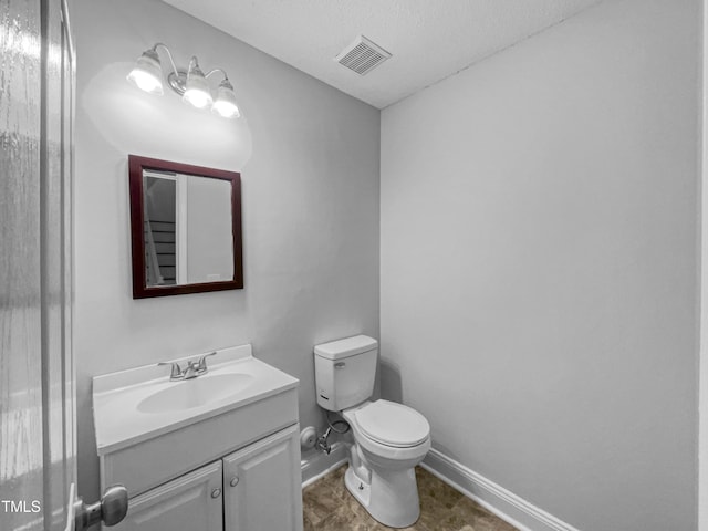 1216 Briarwood Dr, Mebane, NC 27302 - half bath featuring vanity, toilet, baseboards, and a textured ceiling