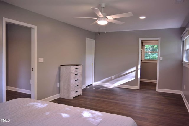 515 Wildwood Dr, Durham, NC 27712 - unfurnished bedroom featuring baseboards, dark wood-style floors, recessed lighting, and a ceiling fan