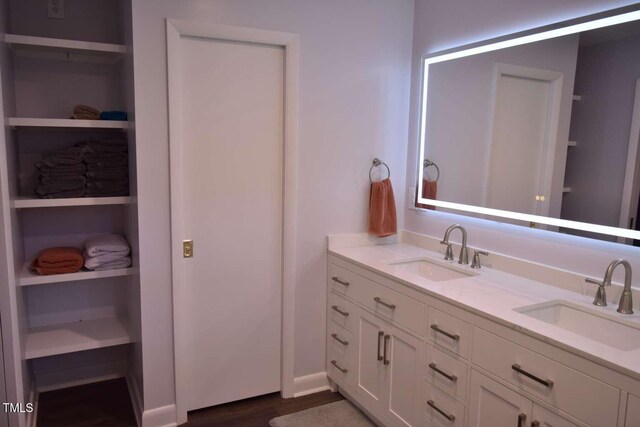 515 Wildwood Dr, Durham, NC 27712 - bathroom with double vanity and wood finished floors