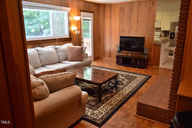 515 Wildwood Dr, Durham, NC 27712 - living room featuring wooden walls