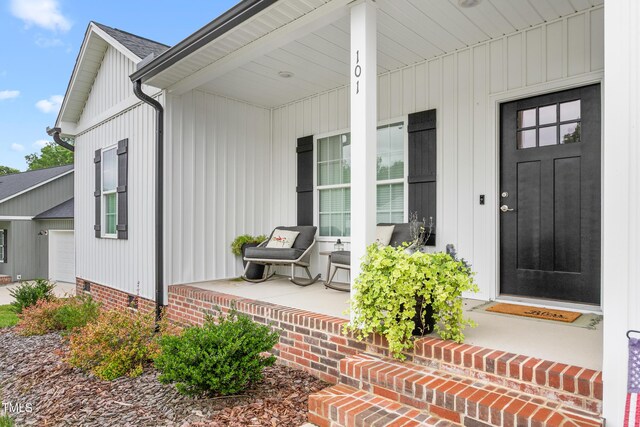 101 Hazy Ln, Thomasville, NC 27360 - entrance to property with a porch and an attached garage