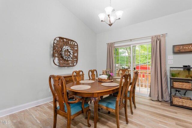 101 Hazy Ln, Thomasville, NC 27360 - dining area with a chandelier, light wood finished floors, vaulted ceiling, and baseboards