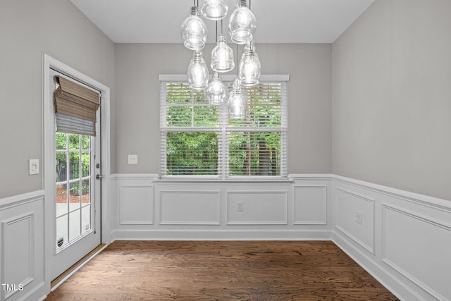 238 Langford Valley Way, Cary, NC 27513 - unfurnished dining area featuring a chandelier, a wainscoted wall, and wood finished floors
