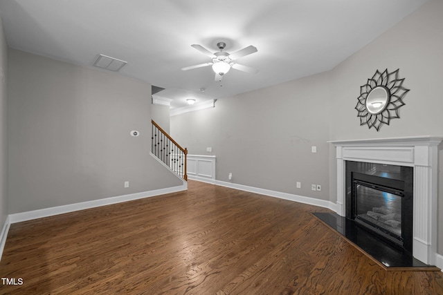 238 Langford Valley Way, Cary, NC 27513 - unfurnished living room featuring a ceiling fan, a glass covered fireplace, stairway, dark wood-style flooring, and baseboards