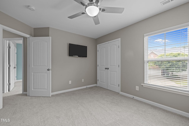 238 Langford Valley Way, Cary, NC 27513 - unfurnished bedroom with carpet, multiple windows, baseboards, and a closet