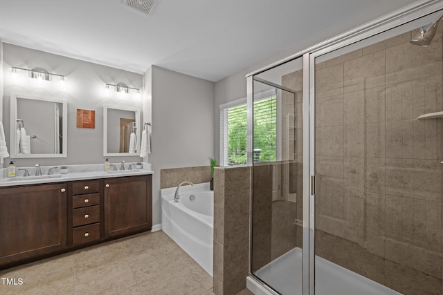 238 Langford Valley Way, Cary, NC 27513 - bathroom featuring double vanity, a stall shower, a garden tub, and tile patterned flooring