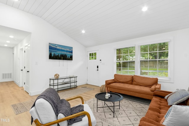 117 Bertie Dr, Raleigh, NC 27610 - living area featuring vaulted ceiling, light wood-style flooring, and recessed lighting
