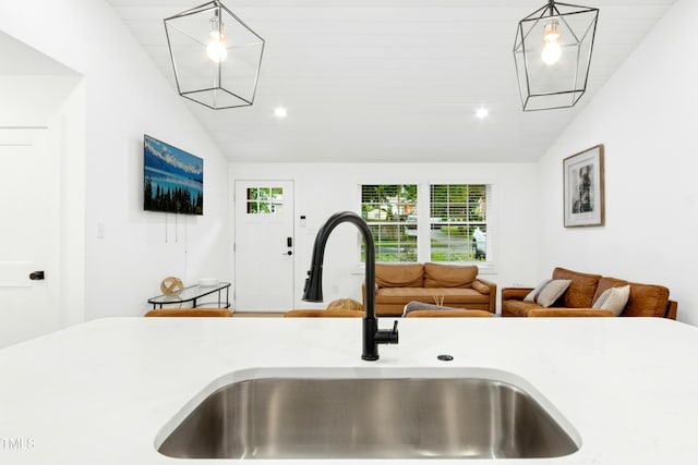 117 Bertie Dr, Raleigh, NC 27610 - kitchen view of a sink, pendant lighting, light countertops, and recessed lighting