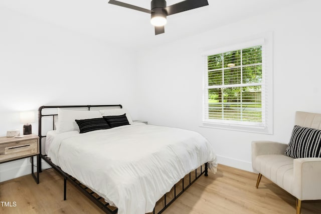 117 Bertie Dr, Raleigh, NC 27610 - bedroom featuring wood finished floors, baseboards, and a ceiling fan