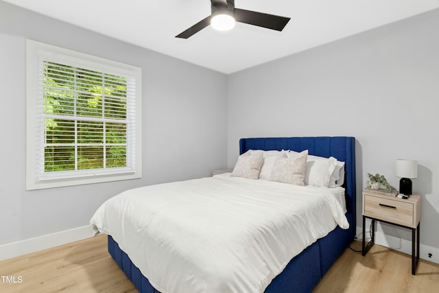 117 Bertie Dr, Raleigh, NC 27610 - bedroom with wood finished floors, baseboards, and a ceiling fan