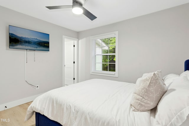 117 Bertie Dr, Raleigh, NC 27610 - bedroom featuring light wood-style flooring, baseboards, and a ceiling fan