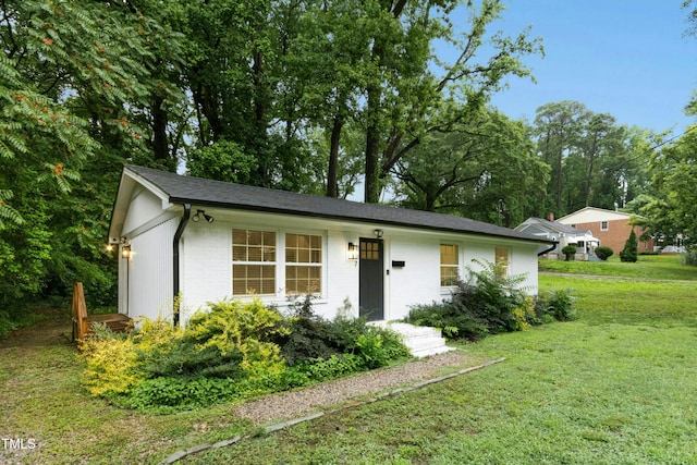 117 Bertie Dr, Raleigh, NC 27610 - ranch-style home with a front lawn