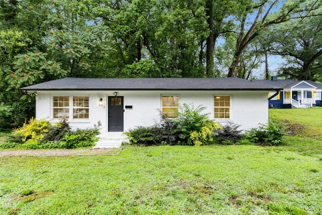 117 Bertie Dr, Raleigh, NC 27610 - ranch-style home with a front lawn and brick siding