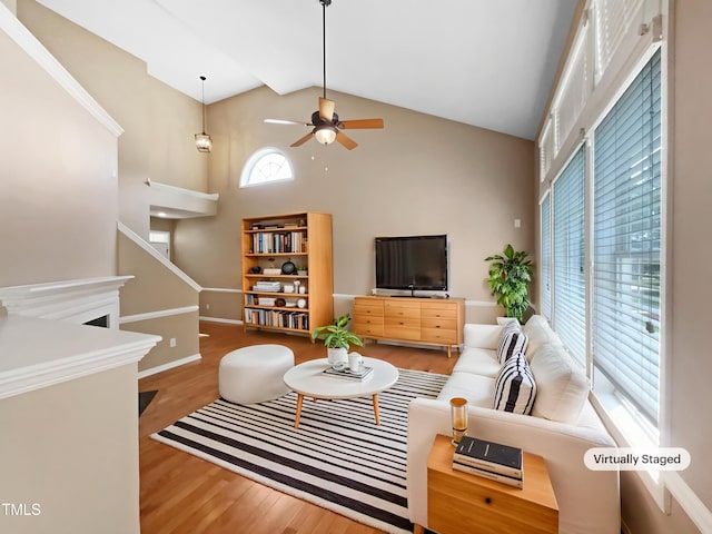 1005 Augustine Trl, Cary, NC 27518 - living room with high vaulted ceiling, wood finished floors, ceiling fan, and baseboards