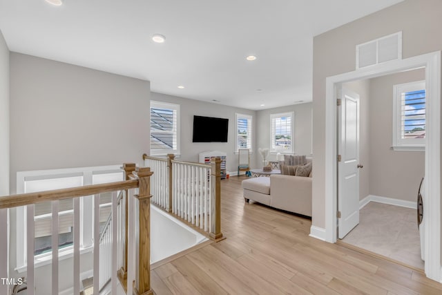 109 Crested Coral Dr, Holly Springs, NC 27540 - hall with an upstairs landing, recessed lighting, light wood-style flooring, and baseboards