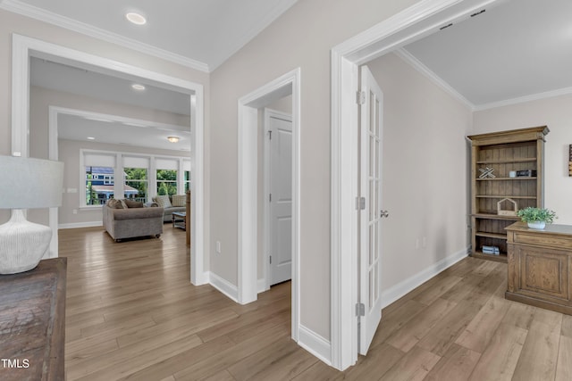 109 Crested Coral Dr, Holly Springs, NC 27540 - hallway with light wood-style flooring, baseboards, ornamental molding, and recessed lighting