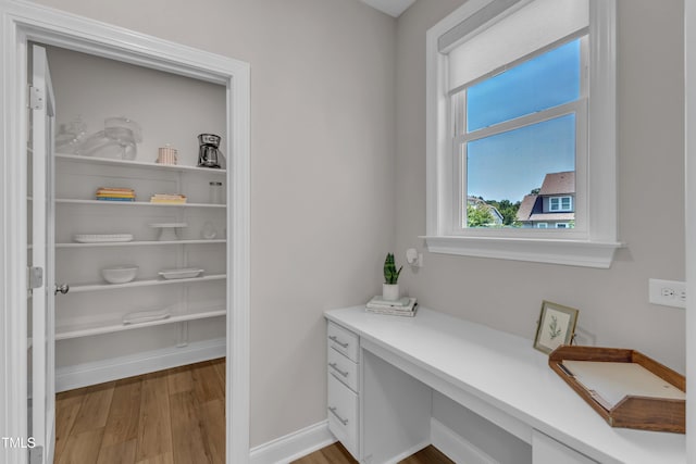 109 Crested Coral Dr, Holly Springs, NC 27540 - office with light wood finished floors, built in study area, and baseboards