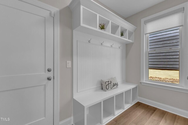 109 Crested Coral Dr, Holly Springs, NC 27540 - mudroom featuring baseboards and light wood-type flooring