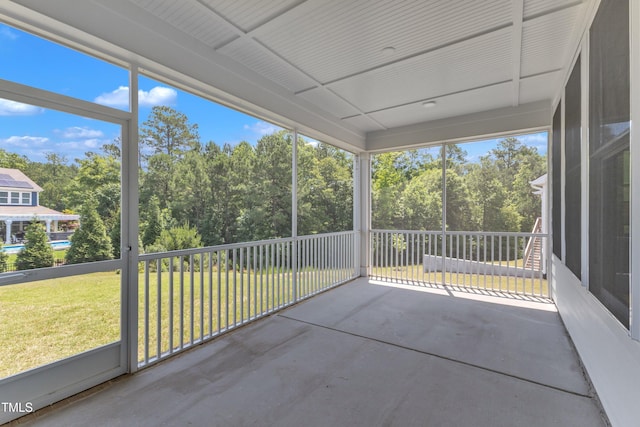 109 Crested Coral Dr, Holly Springs, NC 27540 - unfurnished sunroom with view of wooded area