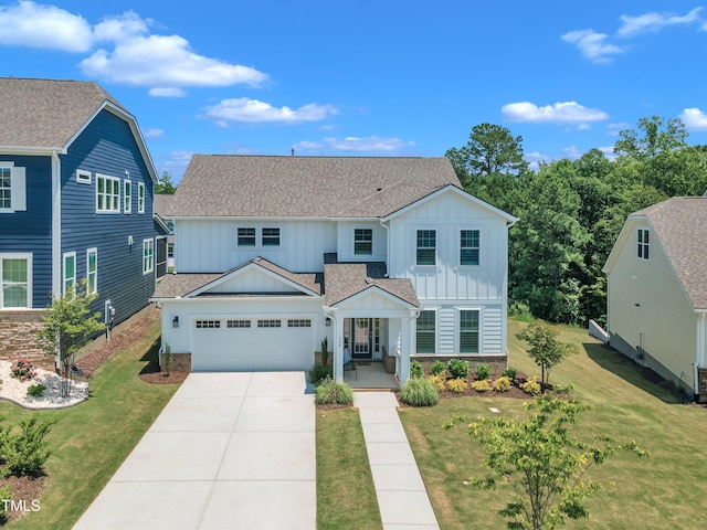 109 Crested Coral Dr, Holly Springs, NC 27540 - view of front of home featuring board and batten siding, a garage, concrete driveway, and a front yard