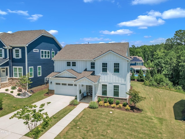 109 Crested Coral Dr, Holly Springs, NC 27540 - view of front of house with board and batten siding, driveway, a front yard, and a garage