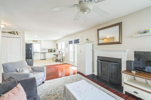 6 Newgate Ct, Durham, NC 27713 - living room featuring light wood-style flooring, a glass covered fireplace, ceiling fan, and recessed lighting
