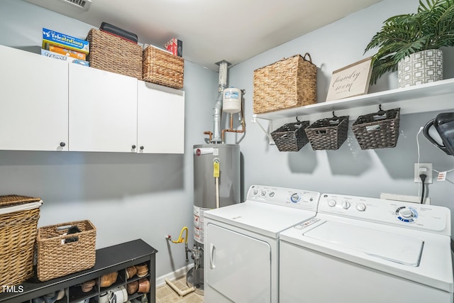 6 Newgate Ct, Durham, NC 27713 - laundry room featuring washing machine and clothes dryer, cabinet space, gas water heater, and baseboards