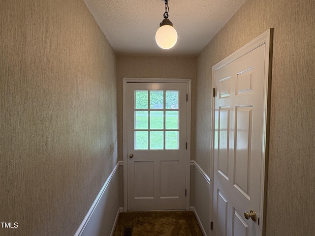 1942 Brier Ln, Graham, NC 27253 - entryway with a textured ceiling and dark colored carpet