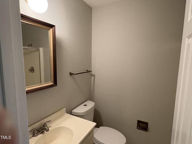 1942 Brier Ln, Graham, NC 27253 - bathroom with toilet, vanity, and a shower