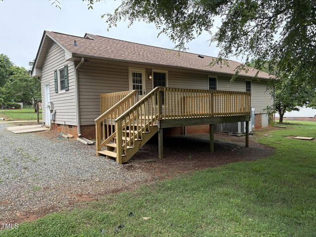 1942 Brier Ln, Graham, NC 27253 - back of house with a deck, a lawn, roof with shingles, stairway, and crawl space