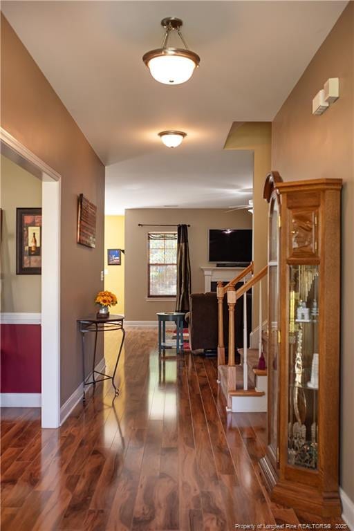 101 Birdsong Ct, Aberdeen, NC 28315 - hallway with wood finished floors, stairs, and baseboards