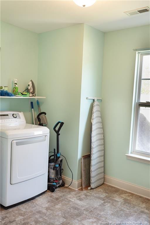101 Birdsong Ct, Aberdeen, NC 28315 - laundry room featuring washer / clothes dryer, baseboards, and stone finish flooring
