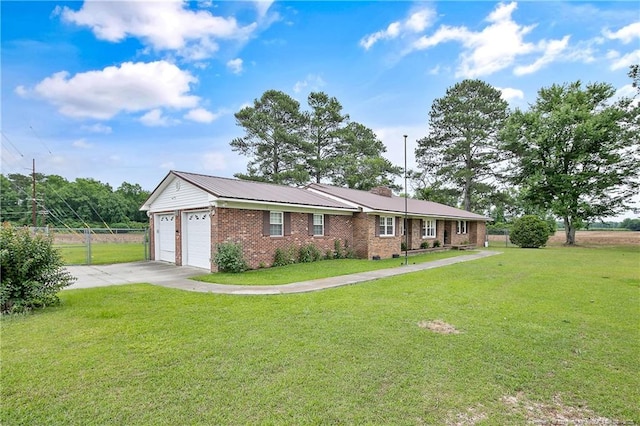 2547 Red Springs Rd, Raeford, NC 28376 - ranch-style house featuring a garage, concrete driveway, and brick siding