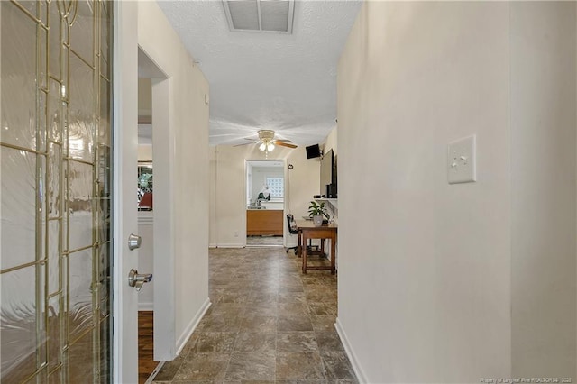 2547 Red Springs Rd, Raeford, NC 28376 - hallway with baseboards, a desk, and stone finish floors