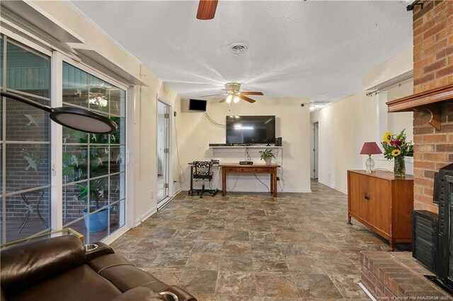2547 Red Springs Rd, Raeford, NC 28376 - living area with ceiling fan, stone finish floors, and baseboards